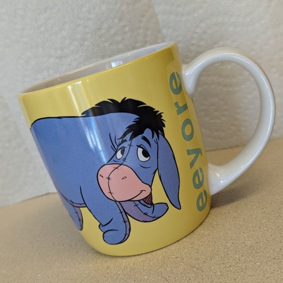 Disney Store Eeyore yellow coffee mug - Picture 1 of 7